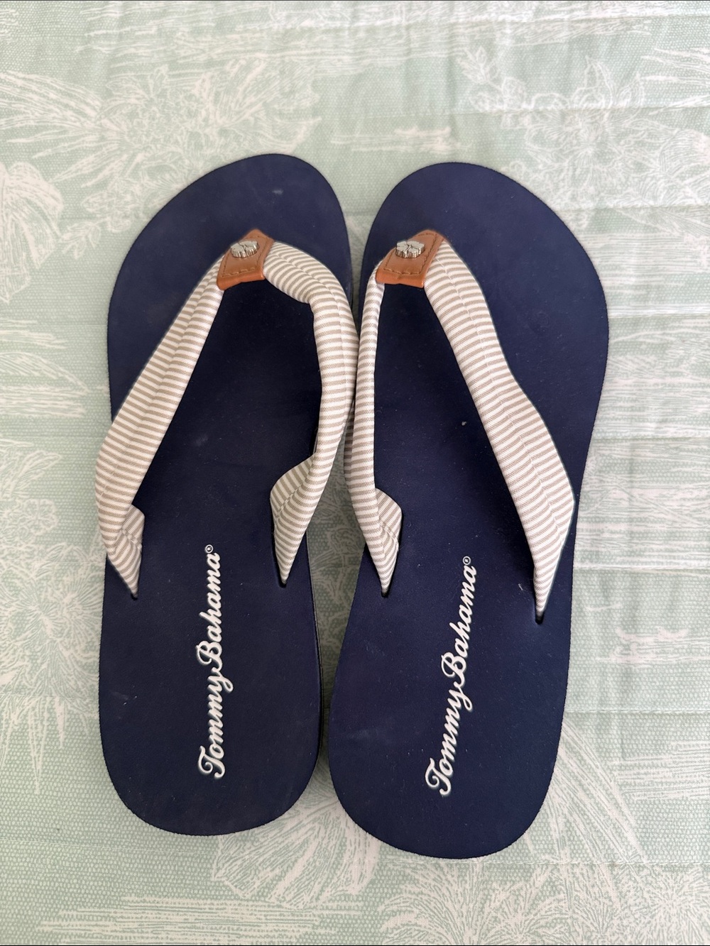 Tommy Bahama Navy Flip Flops with Cream Striped Straps and Tan Accents